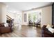 Inviting living room with a bay window, hardwood floors, and comfortable seating at 935 Mill Creek Ave, Canton, GA 30115