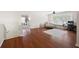 Spacious living room with hardwood floors, an abundance of natural light, and a comfortable seating area at 935 Mill Creek Ave, Canton, GA 30115
