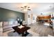 Spacious living room with stylish furnishings, a ceiling fan, and an open layout connected to the kitchen at 935 Mill Creek Ave, Canton, GA 30115