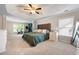 Spacious main bedroom boasts a tray ceiling, large windows, and plenty of room for a home gym at 935 Mill Creek Ave, Canton, GA 30115