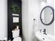 Charming powder room with modern fixtures, decorative mirror, and stylish accents, creating a welcoming space at 935 Mill Creek Ave, Canton, GA 30115