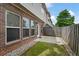 Cozy backyard with a patio, small lawn, and wood fence perfect for relaxing or entertaining at 1957 Brightleaf Way # 59, Marietta, GA 30060