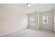 Bedroom featuring neutral walls, plush carpet and two large windows at 1957 Brightleaf Way # 59, Marietta, GA 30060
