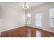Dining area with hardwood floors, chandelier, and natural light from the windows at 1957 Brightleaf Way # 59, Marietta, GA 30060
