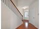 Inviting foyer featuring hardwood floors, a staircase with iron railings, and natural light at 1957 Brightleaf Way # 59, Marietta, GA 30060