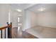 Hallway with hardwood floors and access to carpeted room at 1957 Brightleaf Way # 59, Marietta, GA 30060