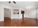 Open living space with hardwood floors and bar access to kitchen with stainless microwave at 1957 Brightleaf Way # 59, Marietta, GA 30060