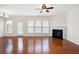 Bright living room with hardwood floors, fireplace, ceiling fan, and large windows at 1957 Brightleaf Way # 59, Marietta, GA 30060