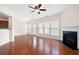 Spacious living area features hardwood floors, fireplace, ceiling fan, and abundant natural light at 1957 Brightleaf Way # 59, Marietta, GA 30060