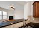 Granite countertop in kitchen with a living room fireplace in the background at 1957 Brightleaf Way # 59, Marietta, GA 30060