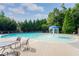 Community pool with a fountain feature and lounge chairs at 1957 Brightleaf Way # 59, Marietta, GA 30060