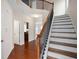 Hardwood staircase with white risers and dark wood trim and bannister at 1957 Brightleaf Way # 59, Marietta, GA 30060