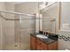 Bathroom featuring a large glass shower, tile, vanity and granite countertop at 3133 Dunton Se St, Smyrna, GA 30080