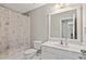 Bathroom featuring a shower/tub, toilet, and a single sink vanity with large mirror at 3133 Dunton Se St, Smyrna, GA 30080
