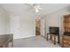 Bedroom with grey carpeting, white trim, neutral walls, a ceiling fan and open door at 3133 Dunton Se St, Smyrna, GA 30080