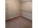 Walk-in closet with carpet floor and white wire shelving at 3133 Dunton Se St, Smyrna, GA 30080