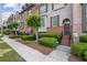 Inviting townhome exterior featuring brick accents, neat landscaping, and a secure ADT sign at 3133 Dunton Se St, Smyrna, GA 30080