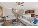 Comfortable living room featuring plush sofas, hardwood floors, and a view of the staircase at 3133 Dunton Se St, Smyrna, GA 30080