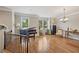 Elegant living room with hardwood floors, piano, and large windows filling the space with light at 3133 Dunton Se St, Smyrna, GA 30080