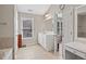 Main bathroom showcasing a walk-in shower, and a vanity with drawers at 3133 Dunton Se St, Smyrna, GA 30080