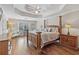 Spacious main bedroom featuring a tray ceiling, hardwood floors, and natural light at 3133 Dunton Se St, Smyrna, GA 30080