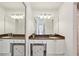 Bathroom vanity with storage, granite countertop, and a modern lighting fixture at 3475 Oak Valley Ne Rd # 2060, Atlanta, GA 30326