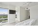 Well-lit bedroom boasting city views from large windows and a ceiling fan at 3475 Oak Valley Ne Rd # 2060, Atlanta, GA 30326