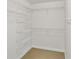 Spacious walk-in closet with ample shelving and a neutral color scheme at 3475 Oak Valley Ne Rd # 2060, Atlanta, GA 30326