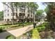 Landscaped garden path leading to building with beautiful trees and greenery at 3475 Oak Valley Ne Rd # 2060, Atlanta, GA 30326