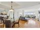 Open-concept living and dining area featuring hardwood floors and city views at 3475 Oak Valley Ne Rd # 2060, Atlanta, GA 30326