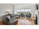 Bright living room with a fireplace, built-in bookshelves, and floor-to-ceiling windows at 3475 Oak Valley Ne Rd # 2060, Atlanta, GA 30326