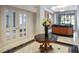 Elegant lobby area featuring a marble table, a flower arrangement, and glass doors at 3475 Oak Valley Ne Rd # 2060, Atlanta, GA 30326
