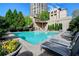 Beautiful outdoor pool area with lounge chairs and mature landscaping in a residential community at 3475 Oak Valley Ne Rd # 2060, Atlanta, GA 30326