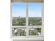 Expansive views showcasing lush greenery and city skyline through a large window at 3475 Oak Valley Ne Rd # 2060, Atlanta, GA 30326
