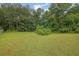 Lush backyard with plenty of green space and privacy from mature trees and greenery at 3513 Newtons Crest Cir, Snellville, GA 30078