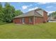 Backyard with grass and brick building at 3513 Newtons Crest Cir, Snellville, GA 30078