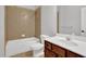 Bathroom features a shower and tub combination with updated vanity and modern fixtures at 3513 Newtons Crest Cir, Snellville, GA 30078