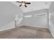 This carpeted primary bedroom features a ceiling fan and an ensuite bath at 3513 Newtons Crest Cir, Snellville, GA 30078