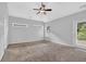 Bedroom boasts light walls, carpet, ceiling fan, and bright windows at 3513 Newtons Crest Cir, Snellville, GA 30078
