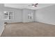 Spacious bedroom featuring plush carpet and two windows providing ample natural light at 3513 Newtons Crest Cir, Snellville, GA 30078