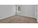 A bright, empty bedroom features neutral walls, carpeted floors, and a window for natural light at 3513 Newtons Crest Cir, Snellville, GA 30078