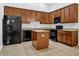 A spacious kitchen features granite countertops, stainless steel appliances, and ample cabinetry at 3513 Newtons Crest Cir, Snellville, GA 30078