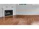 Bright living room boasts a fireplace, hardwood floors, and ample natural light at 3513 Newtons Crest Cir, Snellville, GA 30078