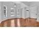 Bright living room features hardwood floors, many windows, and a front door at 3513 Newtons Crest Cir, Snellville, GA 30078