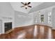 Spacious living room with hardwood floors, fireplace, and natural light at 3513 Newtons Crest Cir, Snellville, GA 30078
