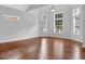 Living room features hardwood floors, lots of windows for light, and neutral paint at 3513 Newtons Crest Cir, Snellville, GA 30078