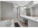 Spacious bathroom with a large vanity, soaking tub, and shower with glass door at 4023 Caitlyn Pl, Atlanta, GA 30360