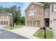 A home with stone facade, two car garage, driveway, front lawn and landscape at 4023 Caitlyn Pl, Atlanta, GA 30360