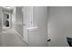 Hallway featuring neutral paint and carpet, with views into other rooms of the home at 4023 Caitlyn Pl, Atlanta, GA 30360
