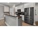Updated kitchen featuring stainless steel appliances, white cabinets, and granite countertops at 4023 Caitlyn Pl, Atlanta, GA 30360